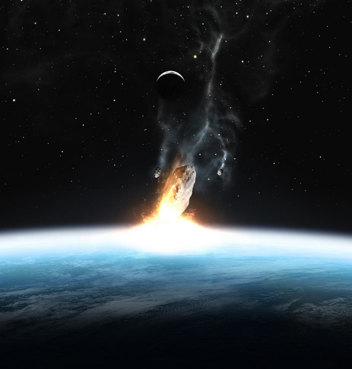 An asteroid hitting the Earth.