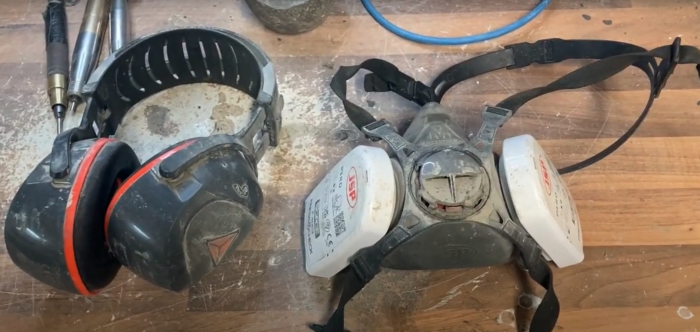 Ear protectors and respirator mask.