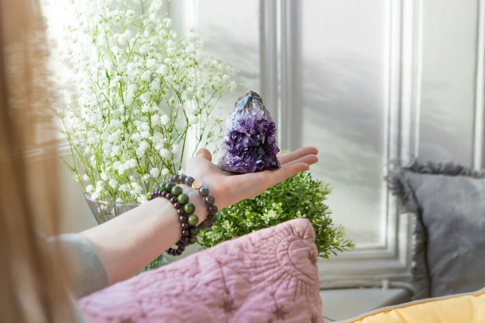 Girl holding an Amethyst cluster.