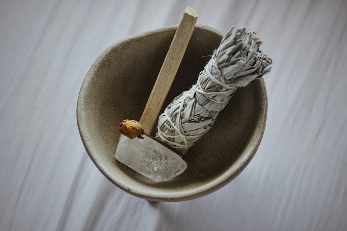 A crystal placed in a bowl for a cleansing routine