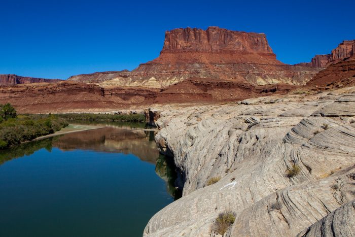 Stunning landscape of Colorado River with eroded rocks and red cliffs in Moab, Utah
